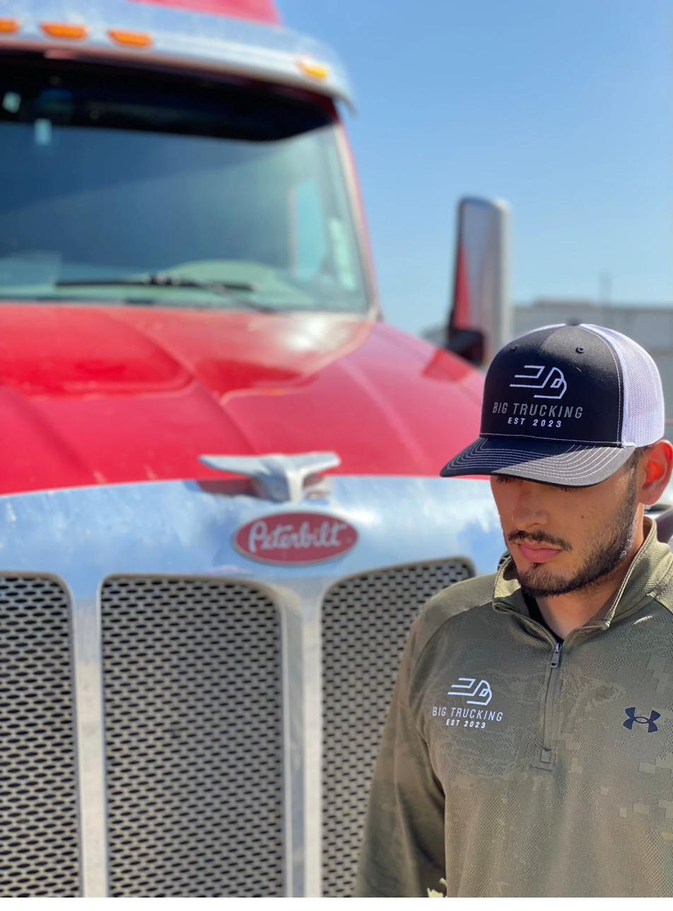 Big Trucking team member with branded gear